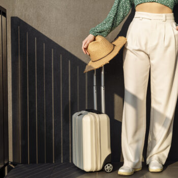 Woman with luggage coming back from a trip